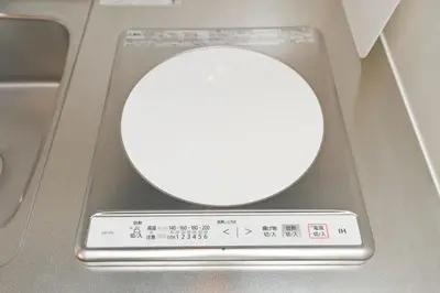 a round object in a machine with a roundimeter at Evergreen hotel ichigaya in Tokyo