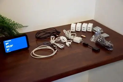 a wooden table with a bunch of electronics on it at M&T stay in Tokyo