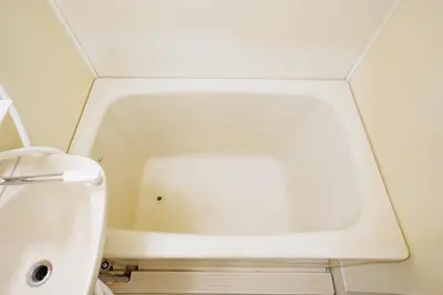 a white bath tub in a small bathroom at HIKA HOUSE Shinkoiwa in Tokyo