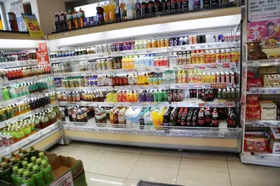 a grocery store aisle with a lot of soda bottles at Pr21 \u4e0b\u843d\u5408 in Tokyo