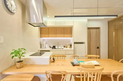 a kitchen and dining room with a table and chairs at STAY ARI Arakicho B in Tokyo