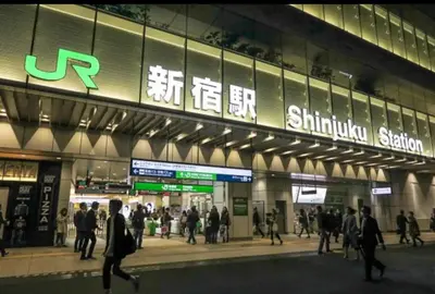a group of people walking in front of a subway station at Home Tokyo Takinogawa in Tokyo