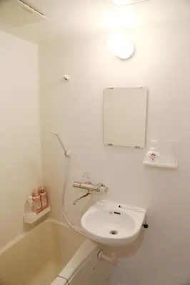 a white bathroom with a sink and a bath tub at Pr22 \u4e0b\u843d\u5408 in Tokyo
