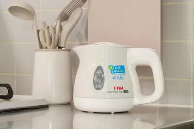a white electric kettle sitting on top of a counter at 7minute walk from JR Takadanobaba Station, 11 minutes from Shinjuku ,Wi-Fi, simple and high-quality space in Tokyo