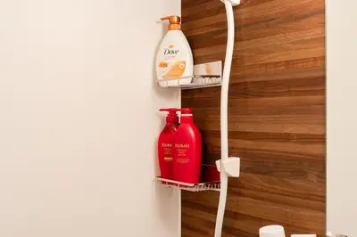 a wall mounted shelf with a bottle of cleaner at 7minute walk from JR Takadanobaba Station, 11 minutes from Shinjuku ,Wi-Fi, simple and high-quality space in Tokyo