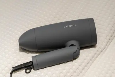 a close up of a stanma router with a charger at 7minute walk from JR Takadanobaba Station, 11 minutes from Shinjuku ,Wi-Fi, simple and high-quality space in Tokyo
