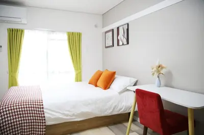 a bedroom with a bed and a desk and a window at Pr33\u4e0b\u843d\u5408 in Tokyo