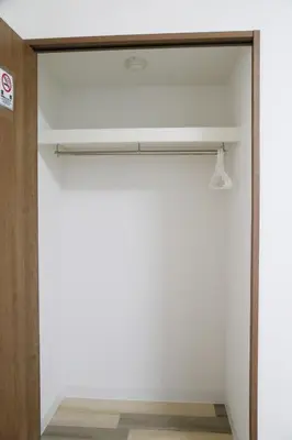 a closet with white walls and a wooden door at Pr35\u4e0b\u843d\u5408 in Tokyo