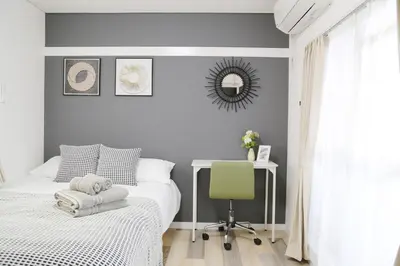 a bedroom with a bed and a desk and a chair at Pr36\u4e0b\u843d\u5408 in Tokyo