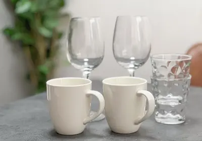 three wine glasses and cups on a table at ojima7 in Tokyo