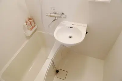 a white bathroom with a toilet and a sink at Pr41\u4e0b\u843d\u5408 in Tokyo