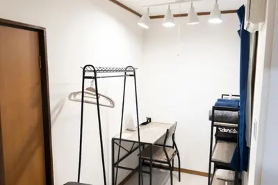 a room with a chair and a table in it at Miyabi in Tokyo