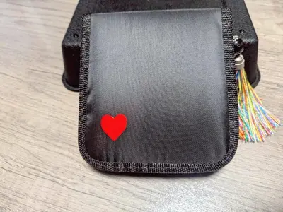 a black wallet with a red heart on it at Miyabi in Tokyo