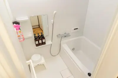 a small bathroom with a toilet and a sink at Miyabi in Tokyo