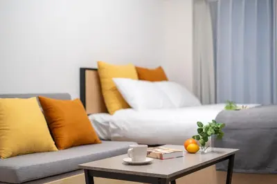 a living room with a couch and a coffee table at \u30ec\u30b8\u30c7\u30a3\u30a2\u4e2d\u843d\u5408c in Tokyo