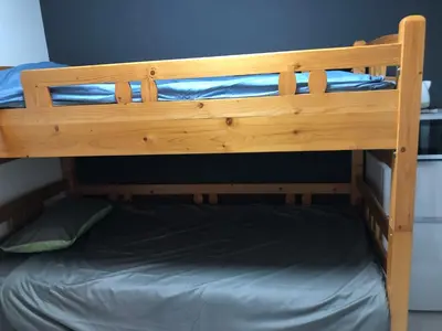 a wooden bunk bed in a room at \u685c\u5c4bSakuraya201 in Tokyo