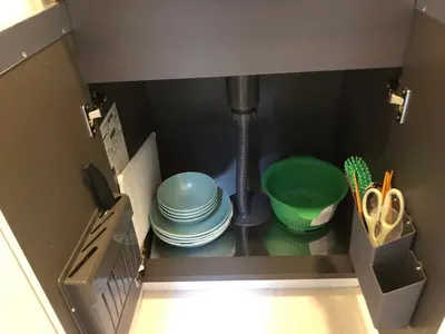 a kitchen with a sink with plates and a mixer at \u685c\u5c4bSakuraya201 in Tokyo