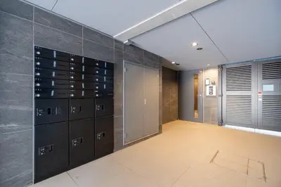 a walk in closet with a wall of wine cabinets at \u30b3\u30f3\u30dd\u30b8\u30c3\u30c8\u5927\u68ee in Tokyo