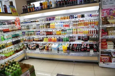 a grocery store aisle with a lot of drinks at Pr44\u4e0b\u843d\u5408 in Tokyo