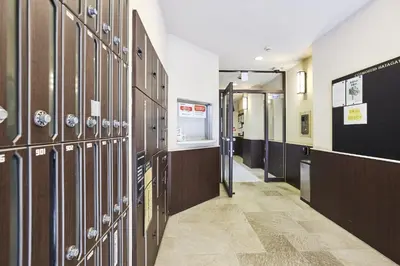 a hallway with lockers in a hospital room at \u30b3\u30b9\u30e2\u30ea\u30fc\u30c9\u5e61\u30f6\u8c37 in Tokyo