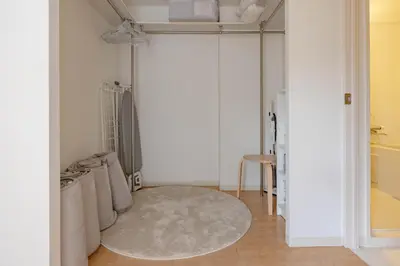 a white room with a rug on the floor at Tokyo Flash Hideout in Tokyo