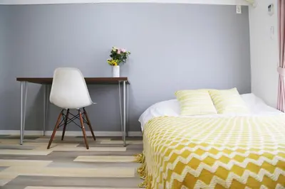 a bedroom with a bed and a desk and a chair at Pr52\u4e0b\u843d\u5408 in Tokyo