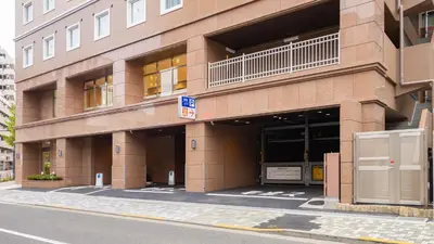 a large brick building on a city street at Toyoko Inn Tokyo Minowa-eki in Tokyo