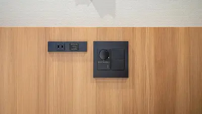 a wall with an electrical outlet on a wooden wall at Toyoko Inn Tokyo Minowa-eki in Tokyo