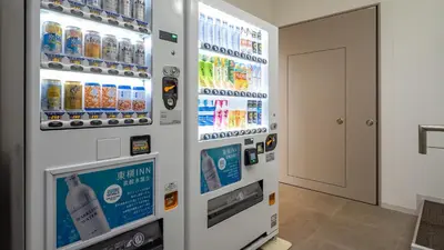 a vending machine with drinks on the wall at Toyoko Inn Tokyo Minowa-eki in Tokyo