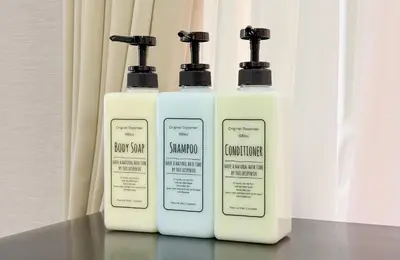 three bottles of soap and shampoo sitting on a table at ginza401 in Tokyo