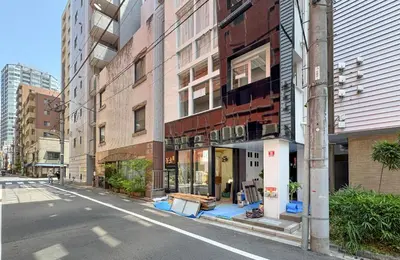 an empty street in a city with buildings at ginza401 in Tokyo