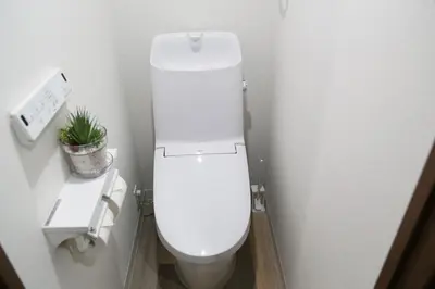 a white toilet in a bathroom with a plant at Pr53\u4e0b\u843d\u5408 in Tokyo