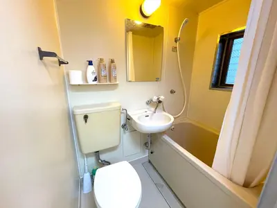 a bathroom with a toilet and a sink at Gest house Near Disneyland in Edogawa