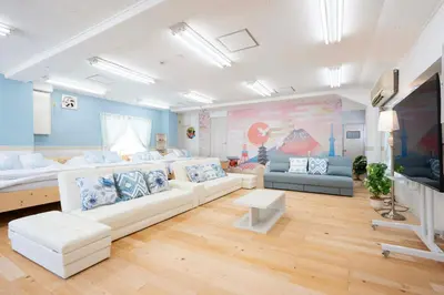 a living room with white couches and a tv at 100sqm,Shinjuku 5min, Shibuya 12min,4F No Elevetor in Tokyo