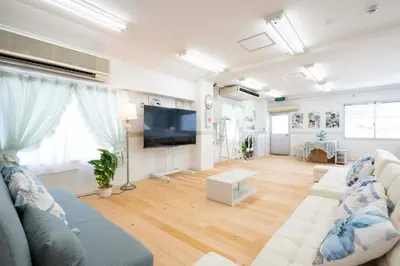 a living room with a couch and a flat screen tv at 100sqm,Shinjuku 5min, Shibuya 12min,4F No Elevetor in Tokyo