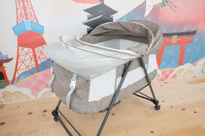 a baby crib on a stand in front of a wall at 100sqm,Shinjuku 5min, Shibuya 12min,4F No Elevetor in Tokyo
