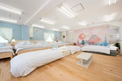 a large room with four beds in it at 100sqm,Shinjuku 5min, Shibuya 12min,4F No Elevetor in Tokyo