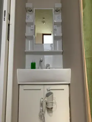 a bathroom with a sink and a mirror at CS Asakusa Building 2nd floor - Vacation STAY 95354v in Tokyo