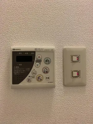 a remote control on a wall next to an electrical outlet at CS Asakusa Building 2nd floor - Vacation STAY 95354v in Tokyo