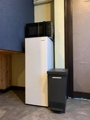 a microwave sitting on top of a refrigerator at CS Asakusa Building 2nd floor - Vacation STAY 95354v in Tokyo