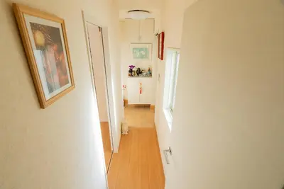 a hallway leading to a room with at shinjuku premier suites tokyo in Tokyo