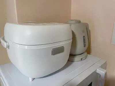 a white toilet sitting on top of a shelf at Sakura Inn Tokyo Skytree in Tokyo