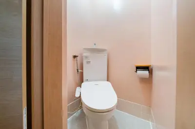 a bathroom with a white toilet in a stall at Sakura Inn Tokyo Skytree in Tokyo