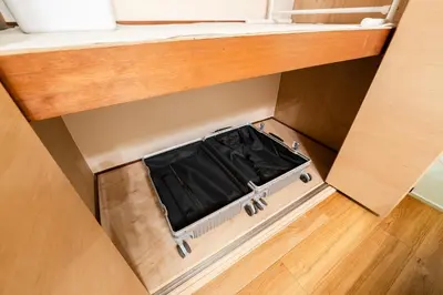 an opening in the floor of a drawer in a room at Sakura Inn Tokyo Skytree in Tokyo