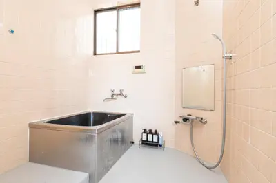 a bathroom with a sink and a shower at The North Ikebukuro Hotel in Tokyo