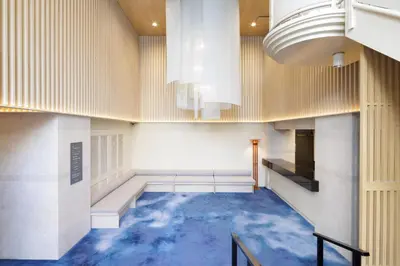 a hallway with a blue floor in a building at HOTEL AMANEK Asakusa Sakurabashi in Tokyo