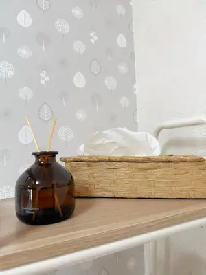 a vase on a table next to a bed at \u9ad8\u8f2a\u30fc703 in Tokyo