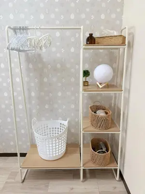 a shelf with baskets and a ball on a wall at \u9ad8\u8f2a\u30fc703 in Tokyo