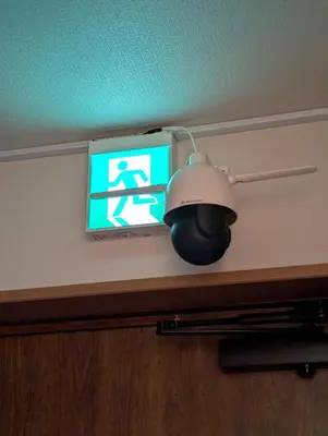 a television with a light attached to a wall at \u6c60\u888b\u672c\u753a302 in Tokyo