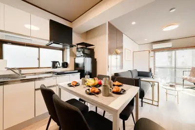 a kitchen and living room with a table and chairs at #32 -\u670d\u90e8\u30d3\u30eb\u6771\u6c60\u888b- Condo in Tokyo